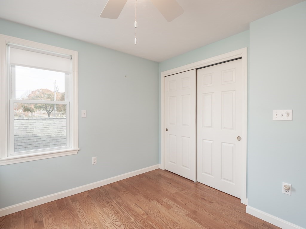 83 Cherry Street Taunton, MA 02780 - Photo 7 of 42 wooden floor in an empty room with a window