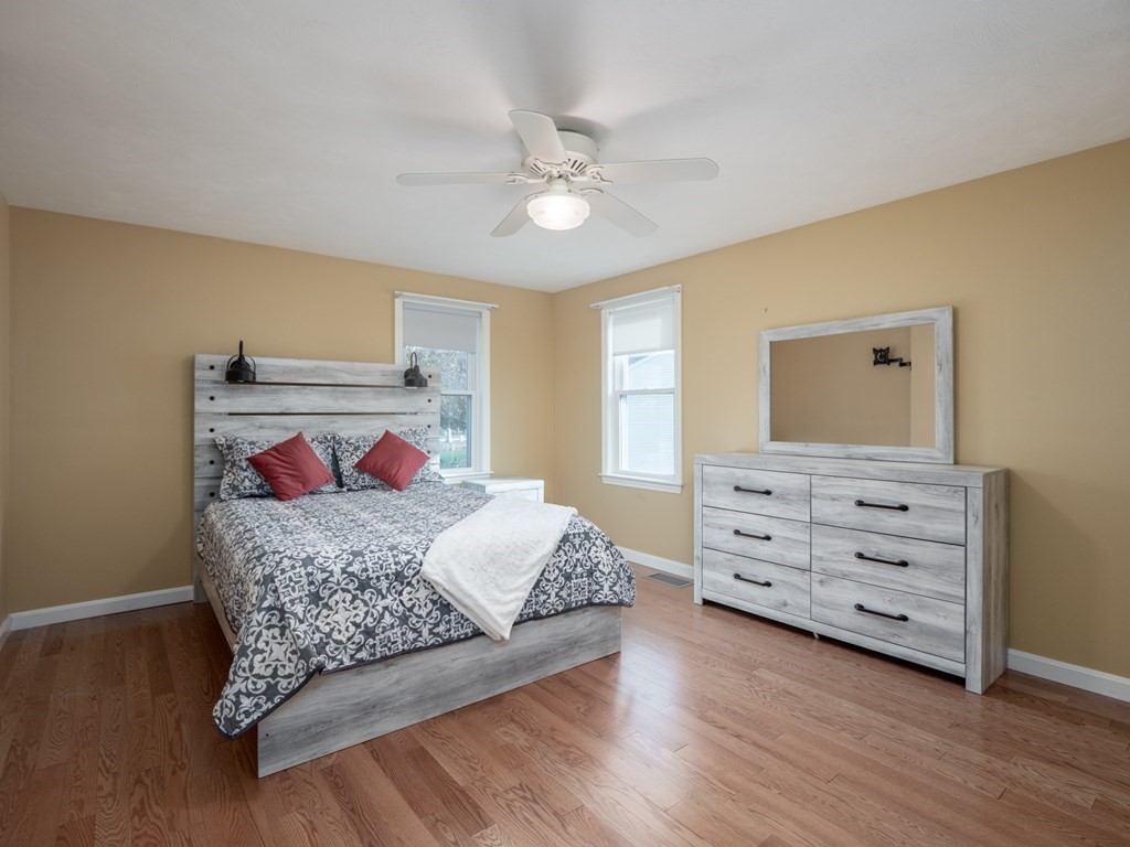 83 Cherry Street Taunton, MA 02780 - Photo 8 of 42 a bedroom with a bed and a dresser