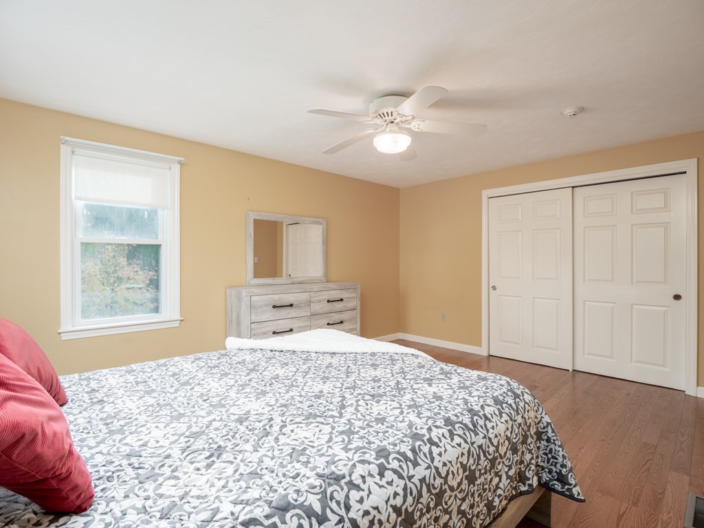 83 Cherry Street Taunton, MA 02780 - Photo 10 of 42 a bedroom with a large bed and a window