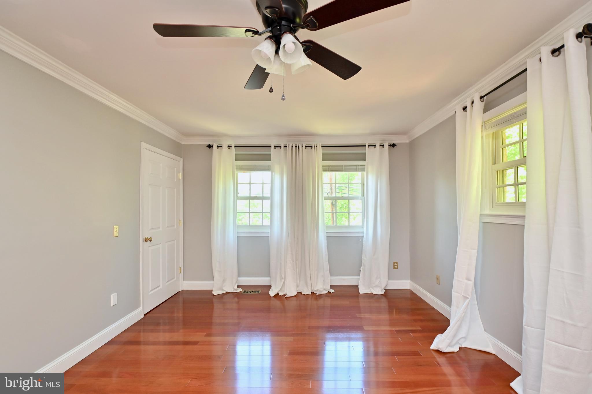 4319 Old Mill Road Alexandria, VA 22309 - Photo 25 of 86 a view of empty room with wooden floor and fan