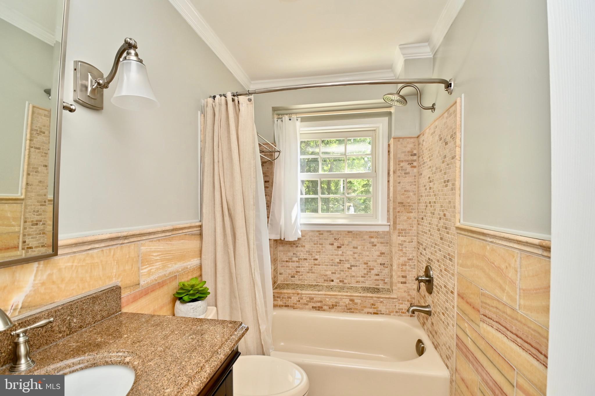 4319 Old Mill Road Alexandria, VA 22309 - Photo 27 of 86 a bathroom with a granite countertop sink toilet and shower