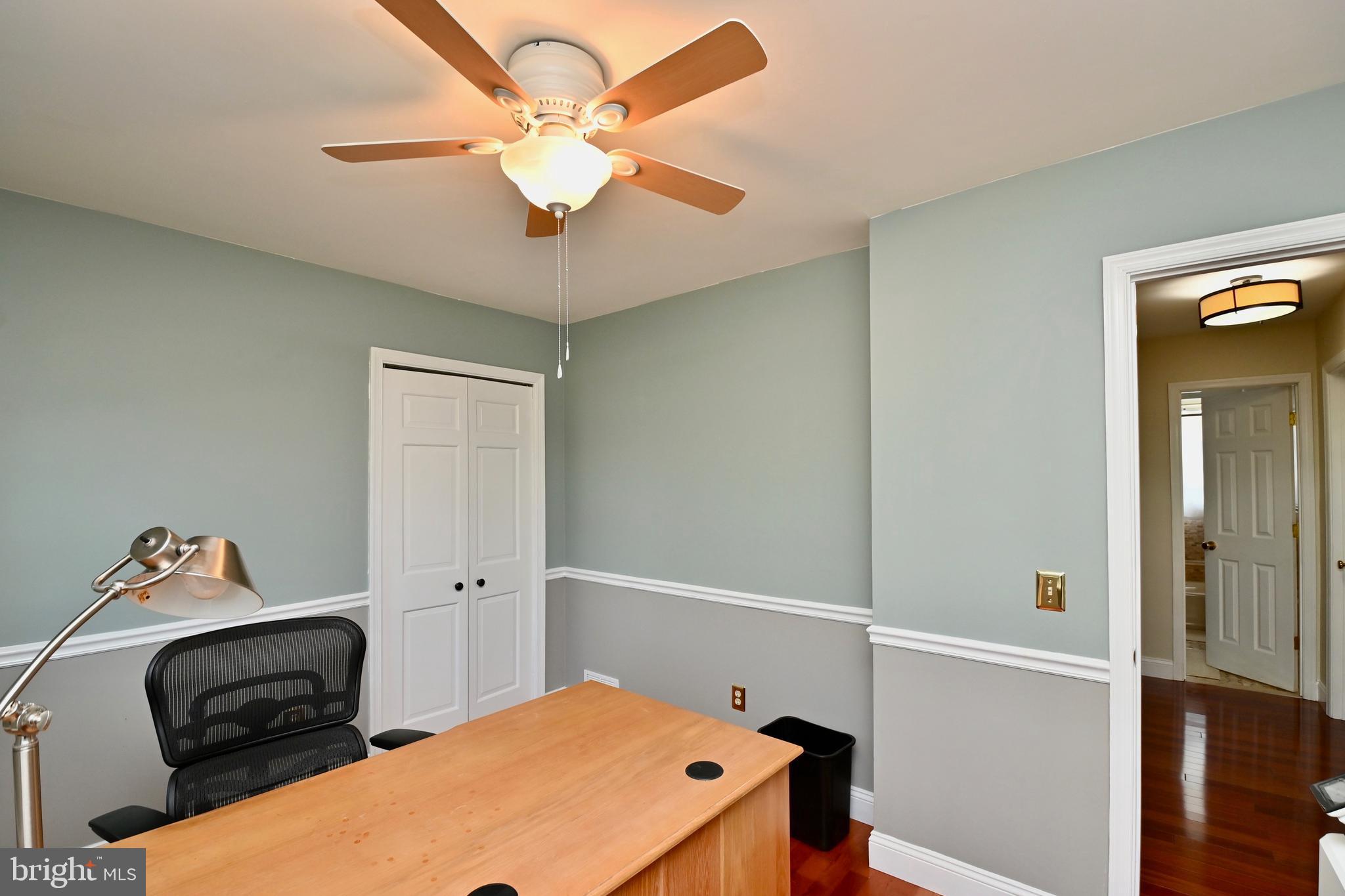 4319 Old Mill Road Alexandria, VA 22309 - Photo 52 of 86 a bedroom with a bed and a chandelier