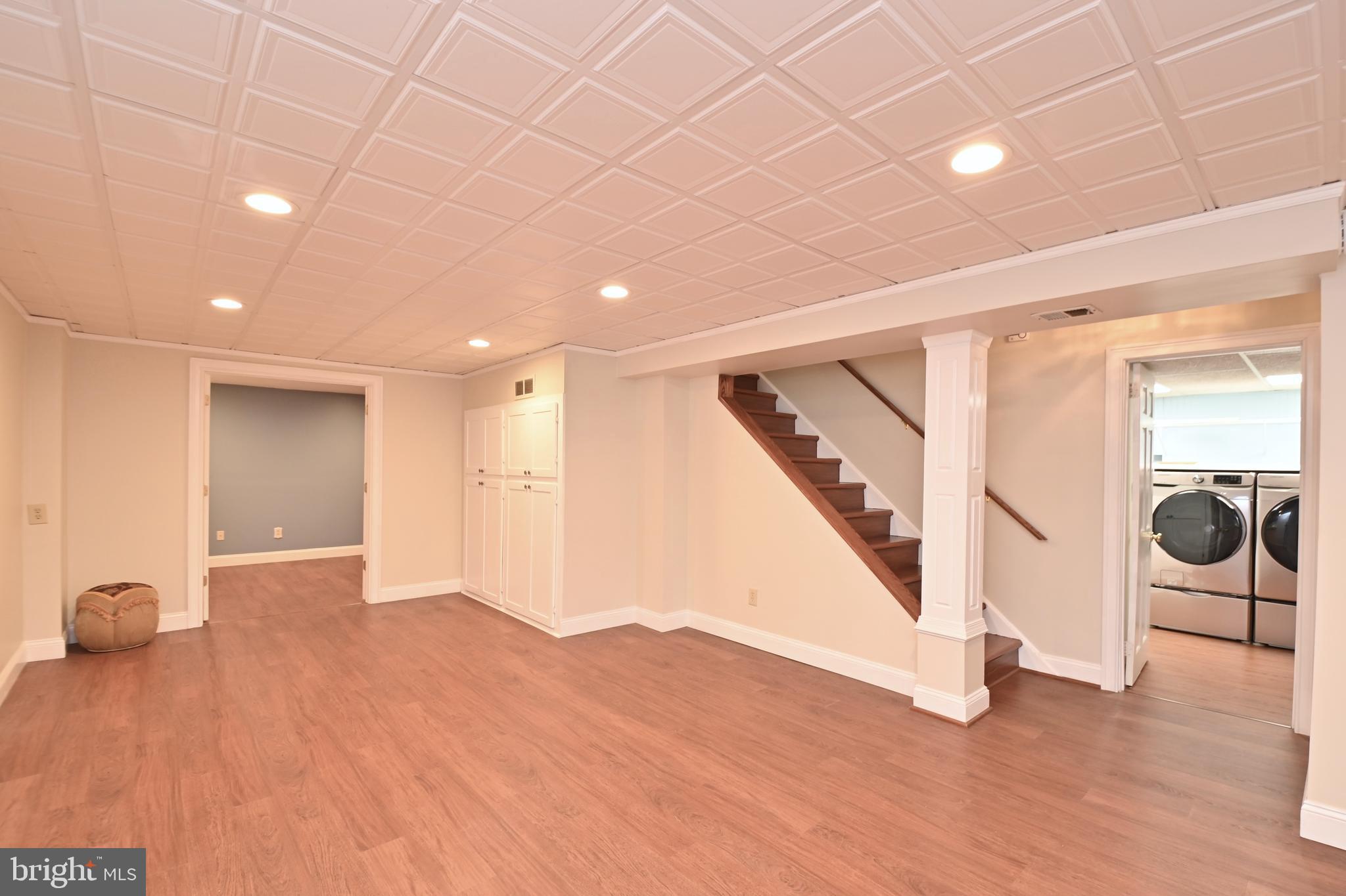 4319 Old Mill Road Alexandria, VA 22309 - Photo 58 of 86 a view of an empty room with wooden floor and stairs