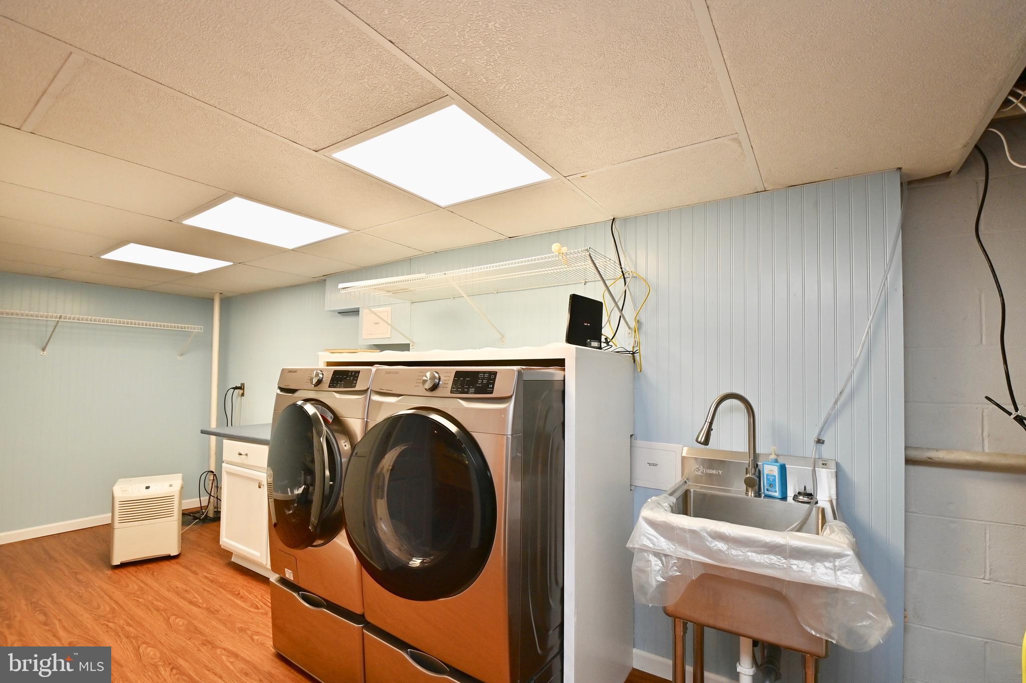 4319 Old Mill Road Alexandria, VA 22309 - Photo 64 of 86 a utility room with sink dryer and washer