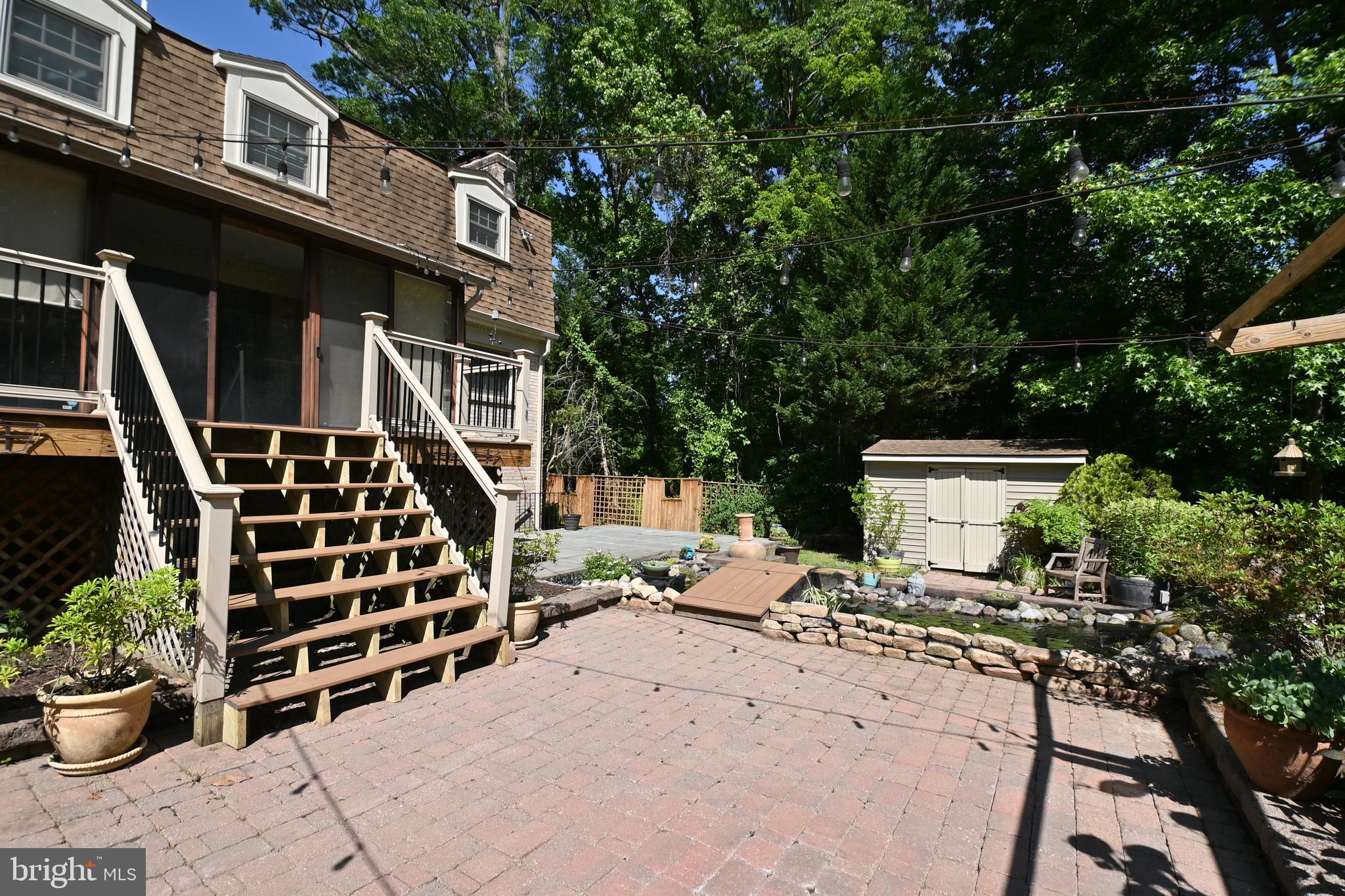 4319 Old Mill Road Alexandria, VA 22309 - Photo 68 of 86 a front view of a house with outdoor seating and plants