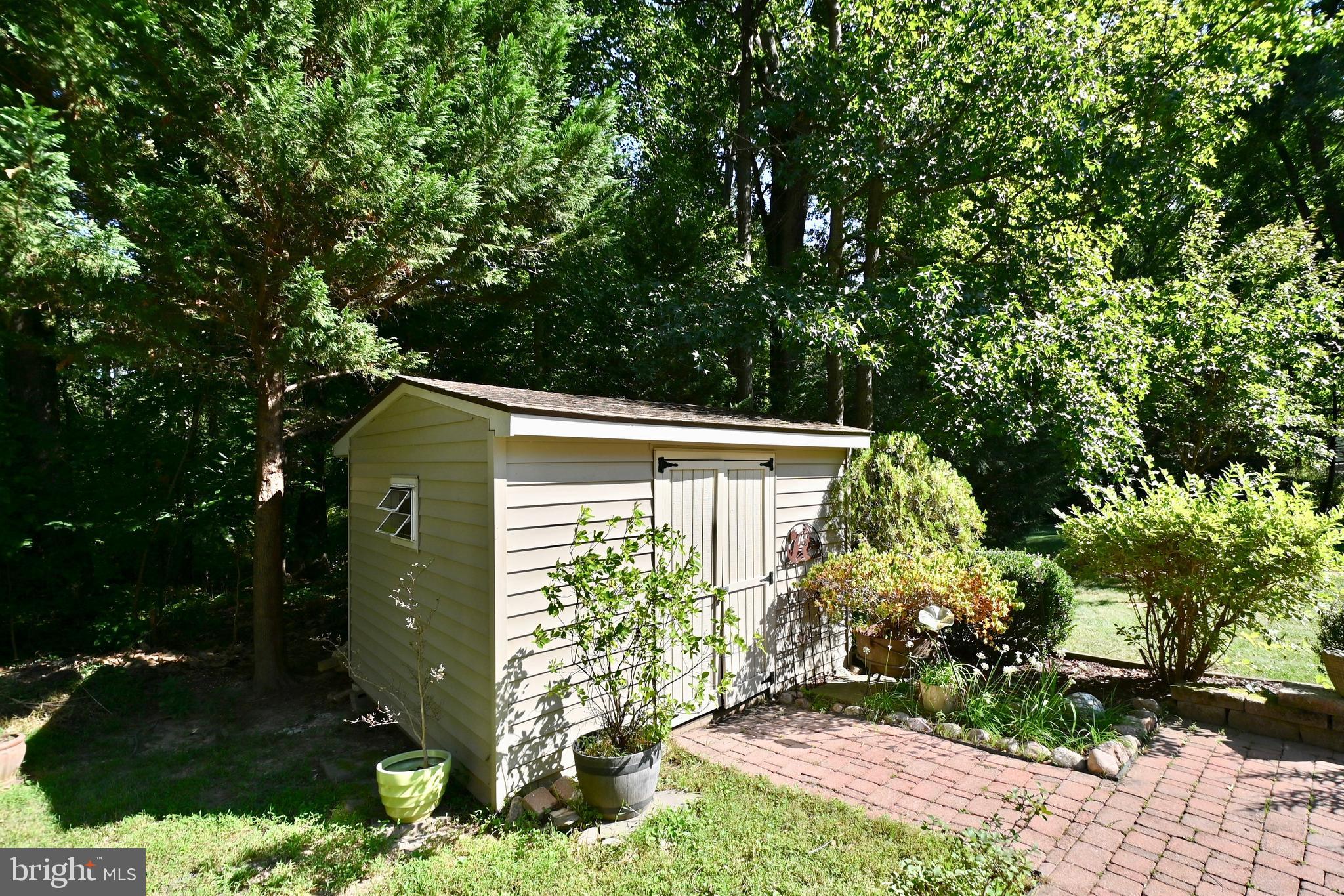 4319 Old Mill Road Alexandria, VA 22309 - Photo 76 of 86 a front view of a house with garden