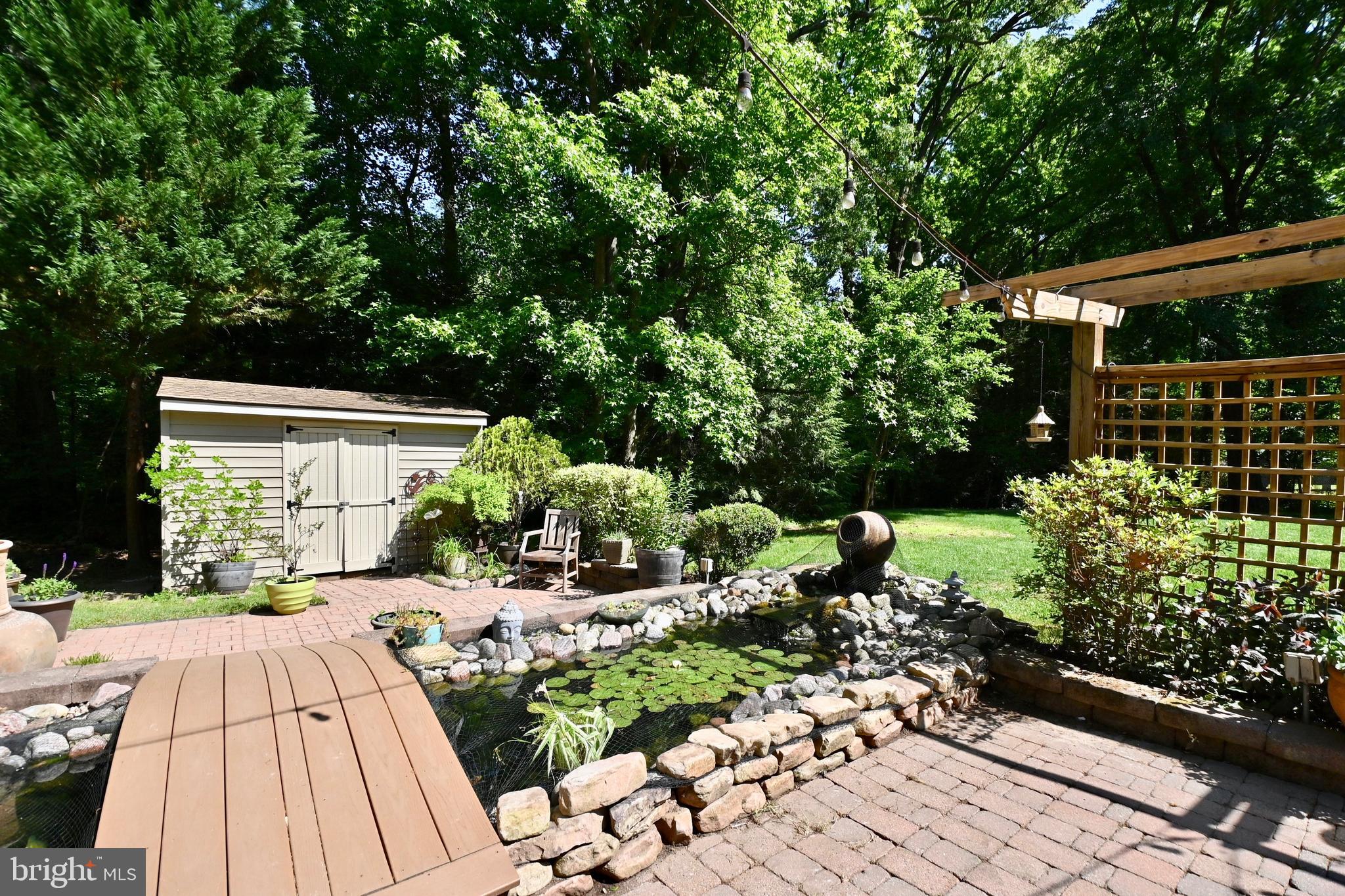 4319 Old Mill Road Alexandria, VA 22309 - Photo 78 of 86 a view of backyard with plants and outdoor seating