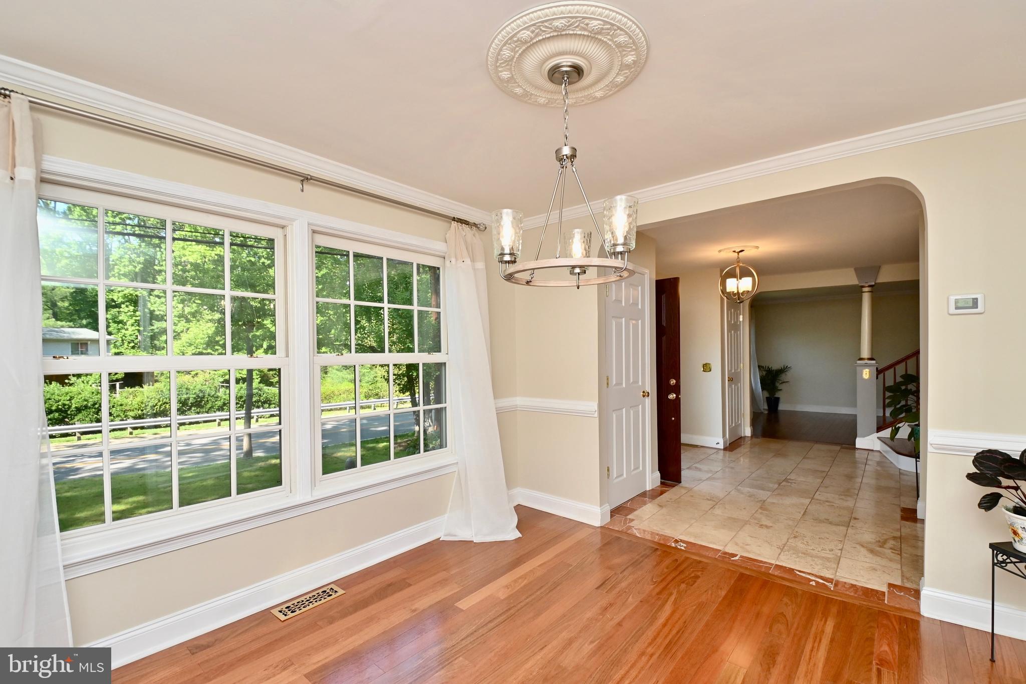 4319 Old Mill Road Alexandria, VA 22309 - Photo 9 of 86 a view of a room with a large window and chandelier
