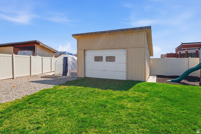 860 West 2980th Street South Logan, UT 84321 - Photo 36 of 38 Detached garage with a roll-up door and two windows