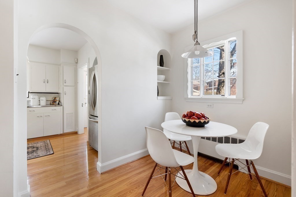 48 Gralynn Road Newton, MA 02459 - Photo 11 of 30 a view of a dining room with furniture wooden floor and a chandelier