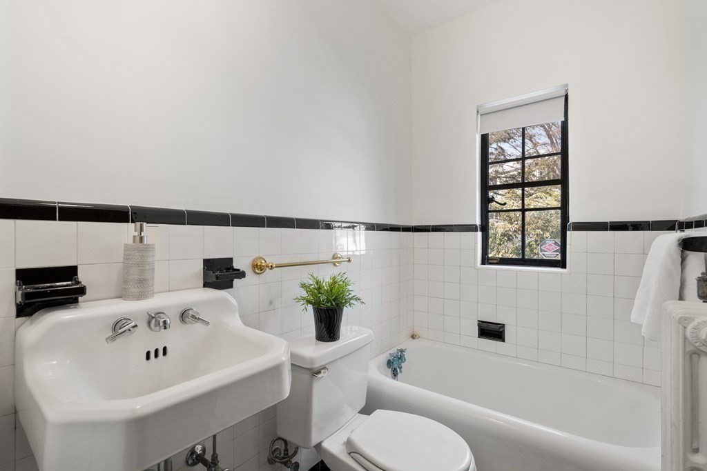 48 Gralynn Road Newton, MA 02459 - Photo 14 of 30 a bathroom with a sink and a mirror with toilet