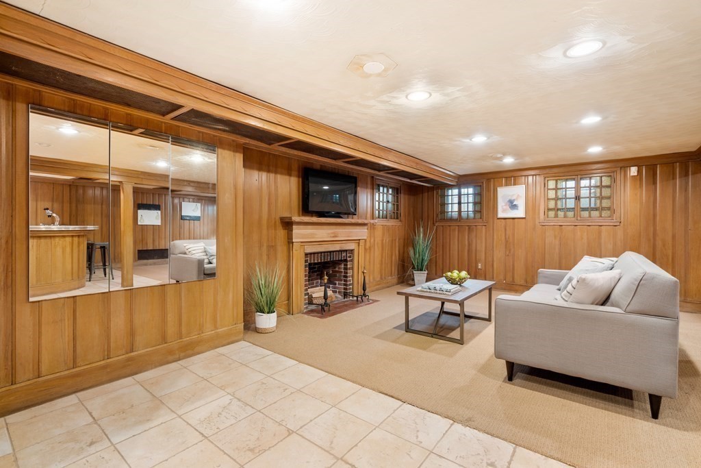 48 Gralynn Road Newton, MA 02459 - Photo 20 of 30 a living room with furniture and a fireplace