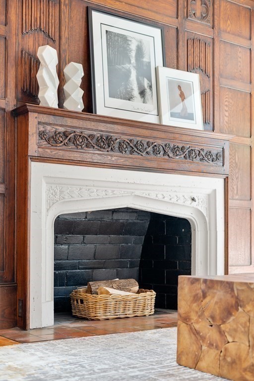 48 Gralynn Road Newton, MA 02459 - Photo 4 of 30 a living room with a fireplace and a wooden floor