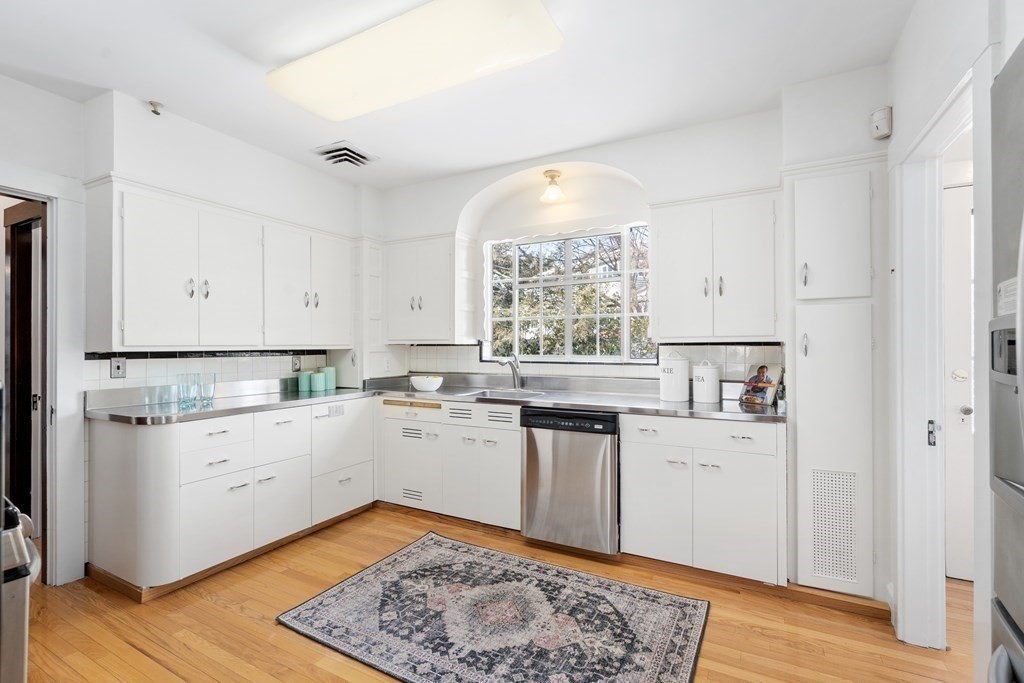 48 Gralynn Road Newton, MA 02459 - Photo 10 of 30 a kitchen with a white cabinets and sink