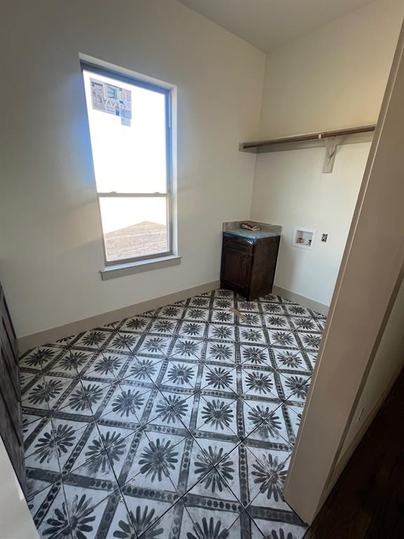 1390 Poe Prairie Road Millsap, TX 76066 - Photo 14 of 40 a bedroom with a bed and a window