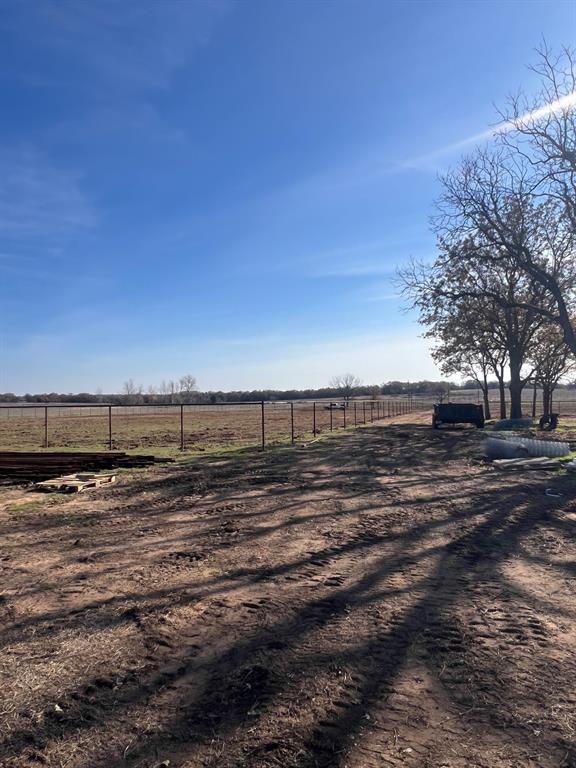 1390 Poe Prairie Road Millsap, TX 76066 - Photo 26 of 40 a view of a yard with wooden fence