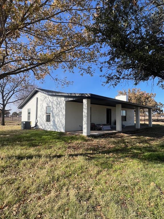 1390 Poe Prairie Road Millsap, TX 76066 - Photo 29 of 40 a view of a house with a yard