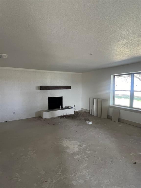 1390 Poe Prairie Road Millsap, TX 76066 - Photo 31 of 40 a view of empty room with a fireplace