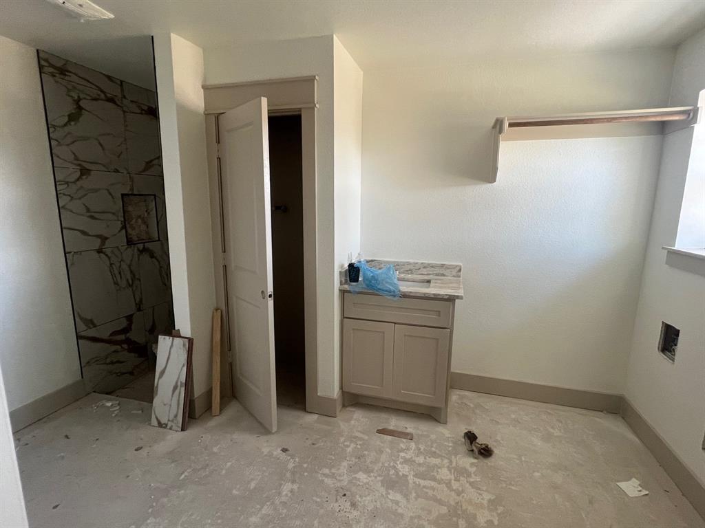 1390 Poe Prairie Road Millsap, TX 76066 - Photo 32 of 40 a view of storage and utility room with washer and dryer