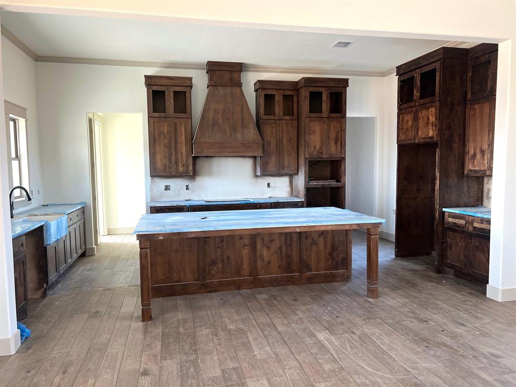 1390 Poe Prairie Road Millsap, TX 76066 - Photo 6 of 40 a living room with a table chairs and kitchen view
