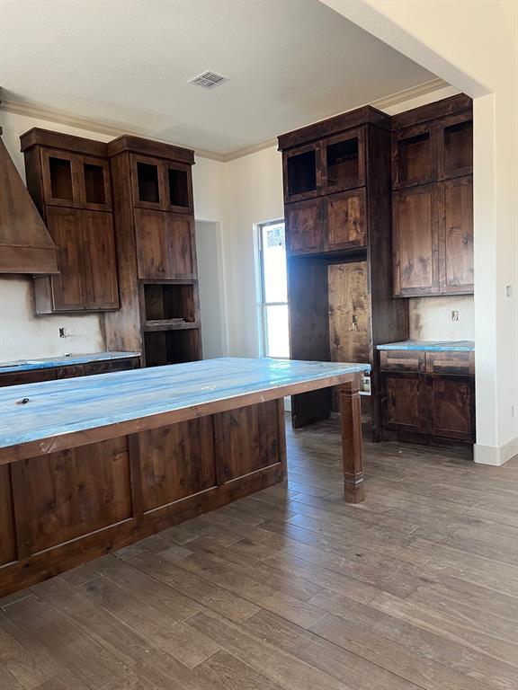 1390 Poe Prairie Road Millsap, TX 76066 - Photo 7 of 40 a living room with stainless steel appliances kitchen island granite countertop a stove a sink and a microwave