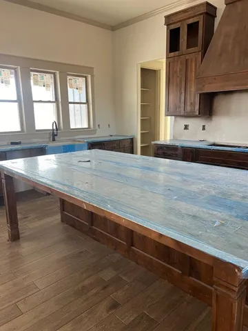 swimming pool view with wooden floor and cabinet