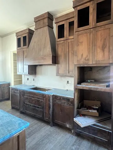 a kitchen with stainless steel appliances granite countertop a stove and a sink