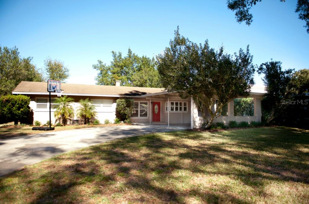 1921 Gunn Road Winter Park, FL 32792 - Photo 1 of 1 a view of a house with a yard