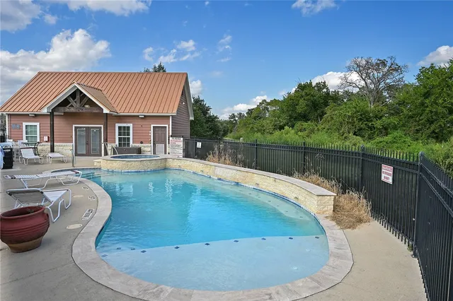 a view of a house with swimming pool