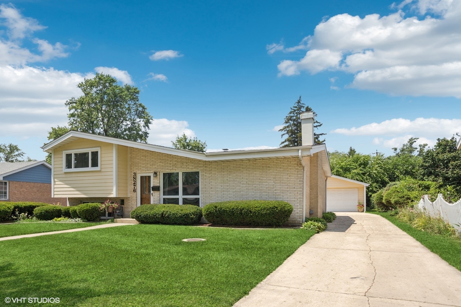 3N276 North Howard Avenue Elmhurst, IL 60126 - Photo 2 of 29 a front view of a house with garden