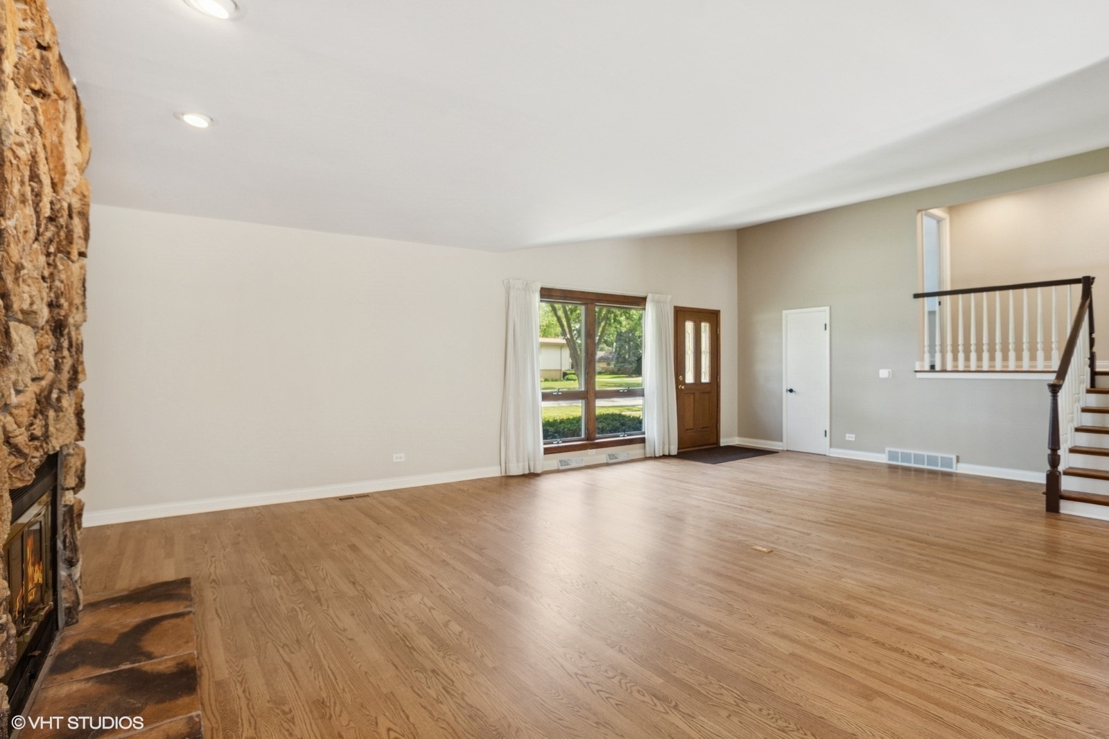3N276 North Howard Avenue Elmhurst, IL 60126 - Photo 5 of 29 an empty room with wooden floor and windows