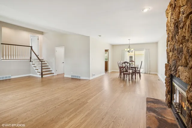 a view of dining room with furniture and wooden floor