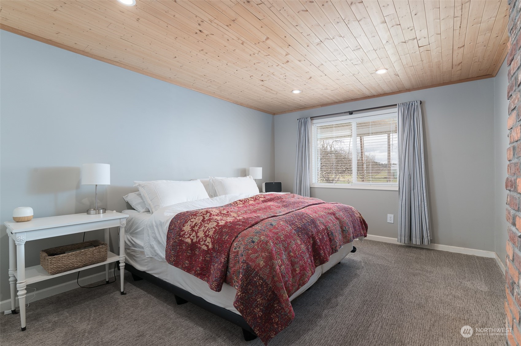 5757 Barr Road Ferndale, WA 98248 - Photo 15 of 40 a bed sitting in a spacious bedroom next to a window