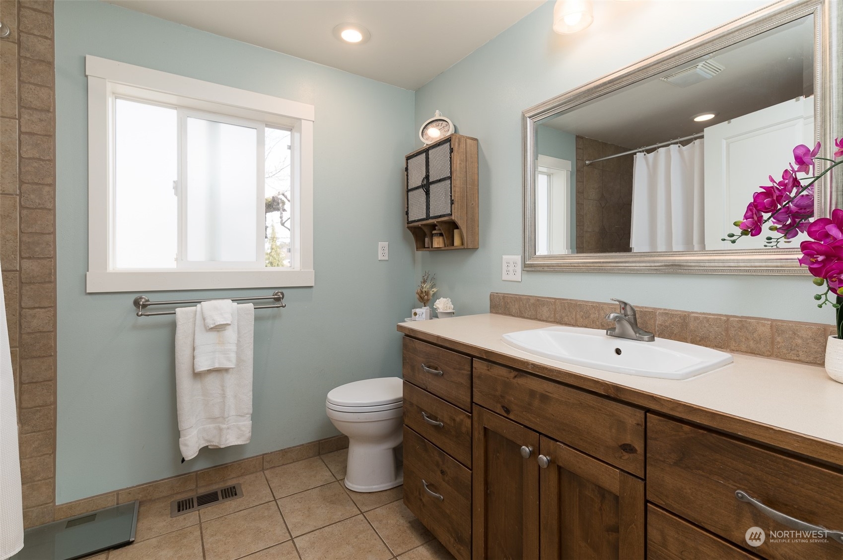 5757 Barr Road Ferndale, WA 98248 - Photo 16 of 40 a bathroom with a toilet sink and mirror