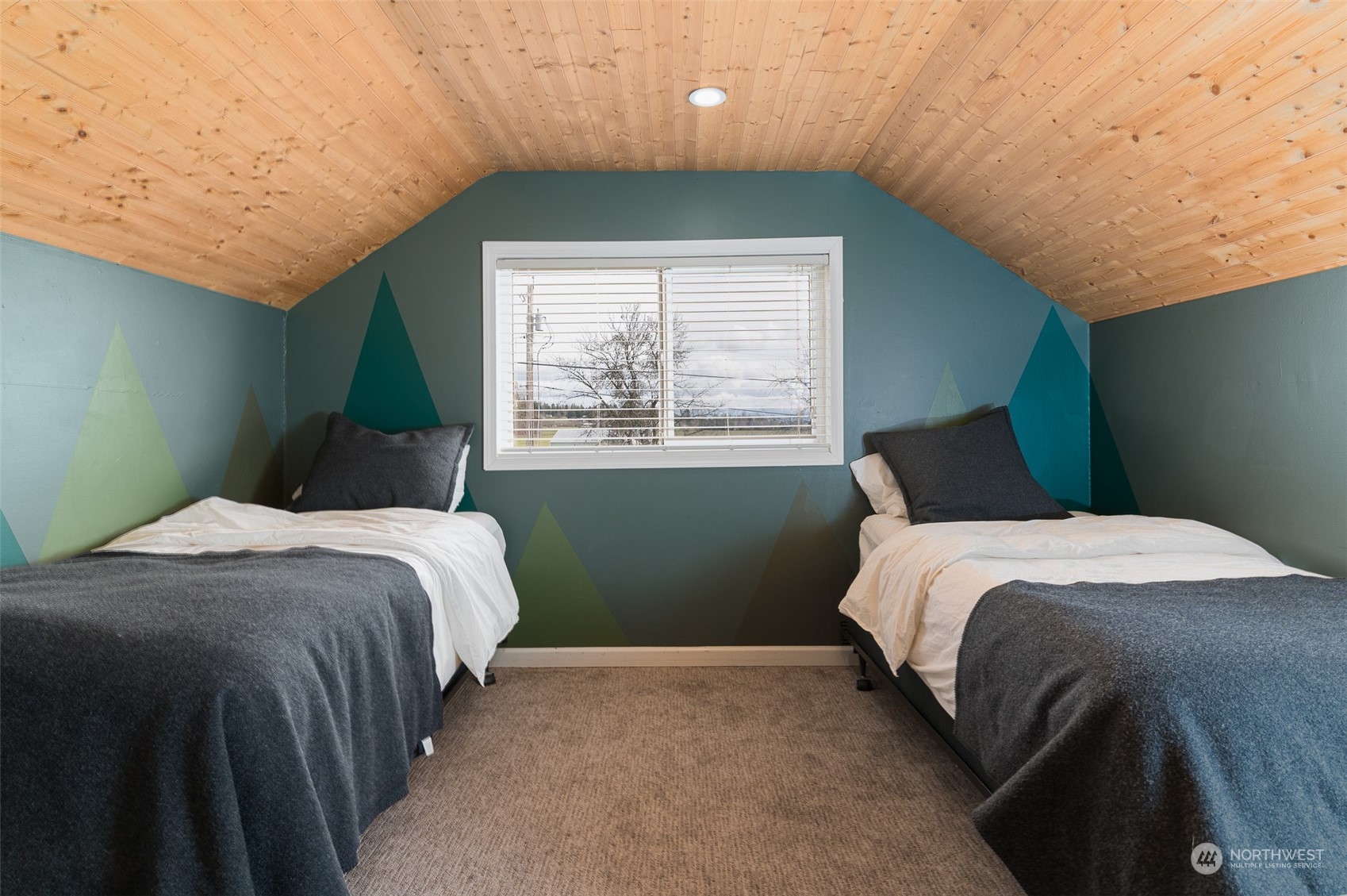 5757 Barr Road Ferndale, WA 98248 - Photo 22 of 40 a bedroom with a bed lamp and window