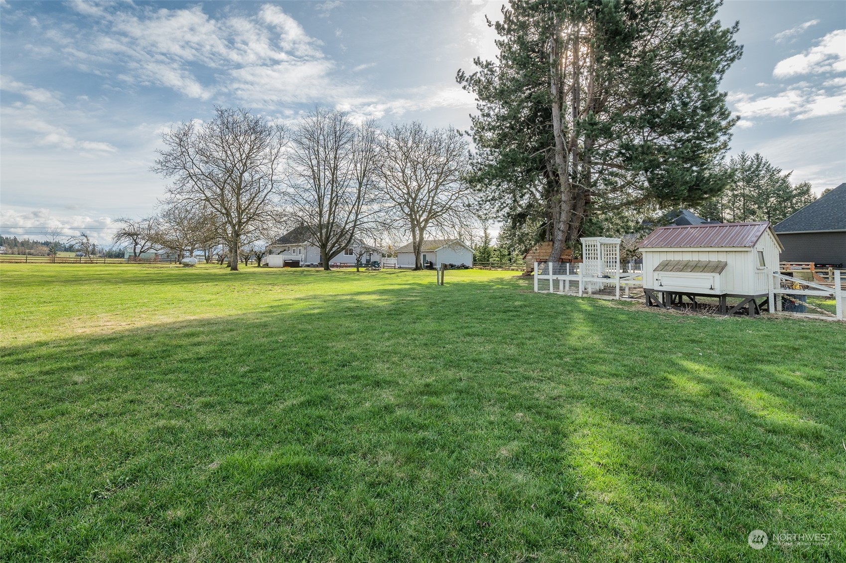 5757 Barr Road Ferndale, WA 98248 - Photo 29 of 40 a view of a house with a big yard and large trees