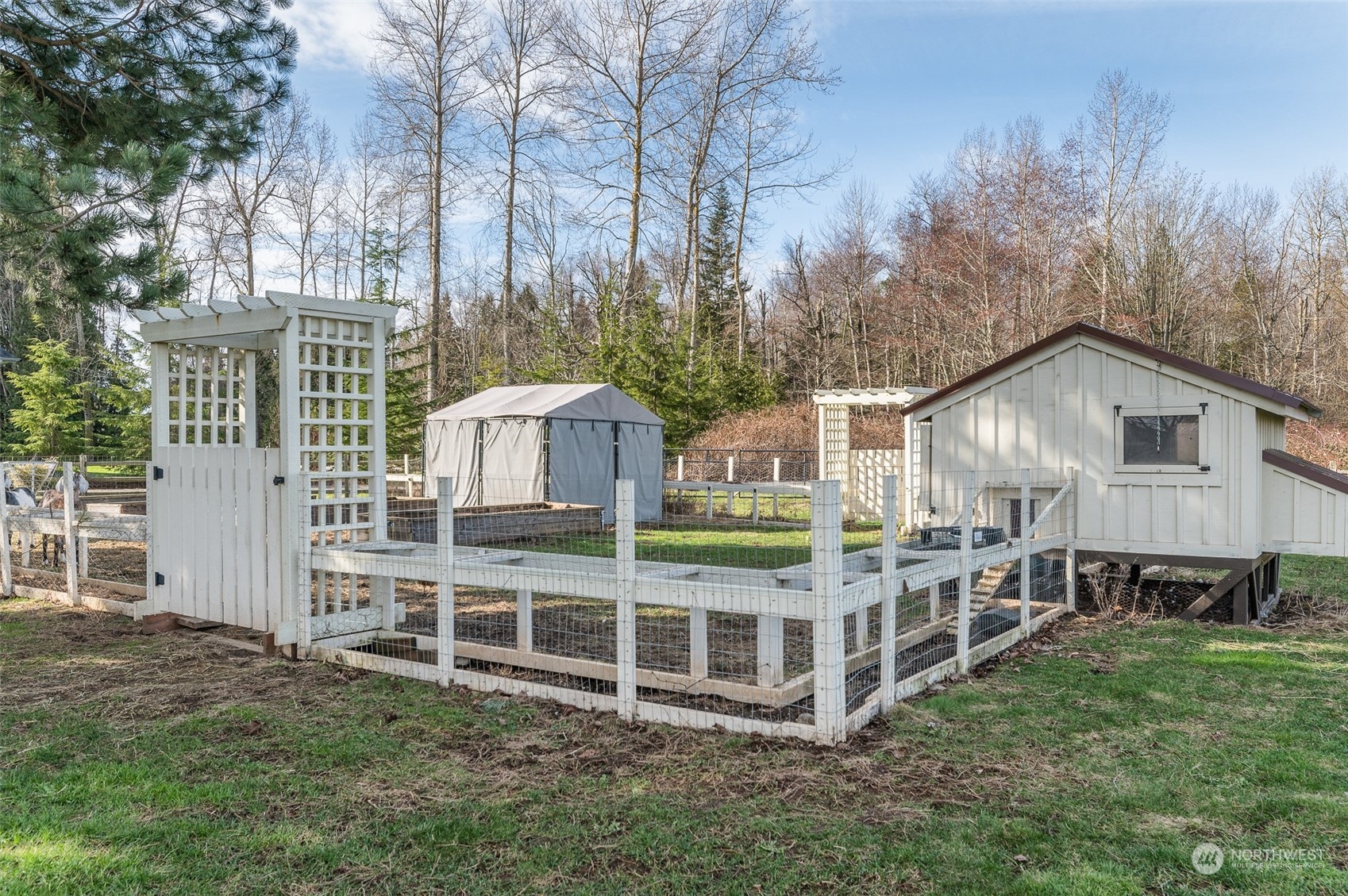 5757 Barr Road Ferndale, WA 98248 - Photo 32 of 40 a view of a house with backyard and trees