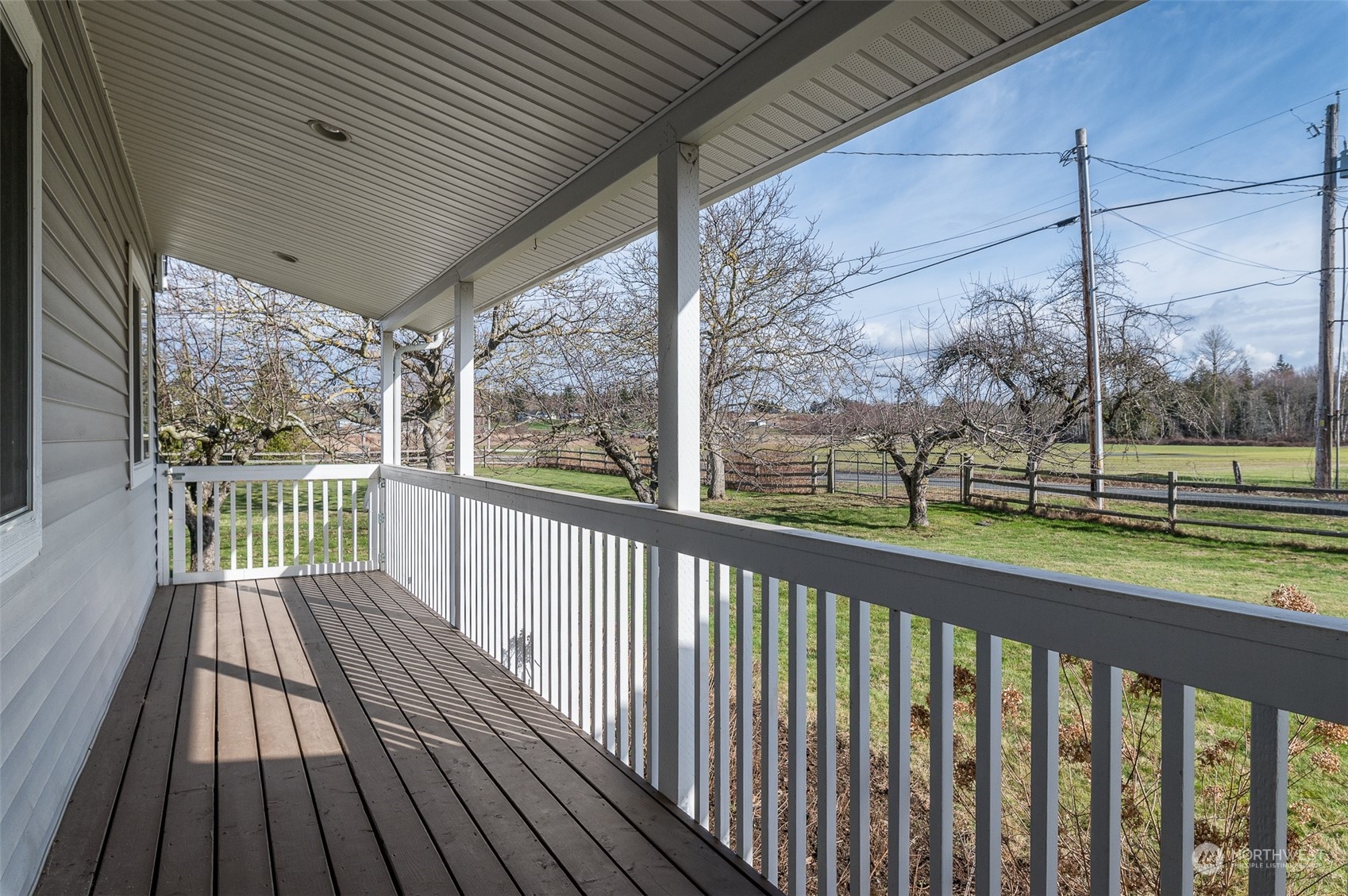 5757 Barr Road Ferndale, WA 98248 - Photo 37 of 40 a view of a porch with wooden floor in front of a house