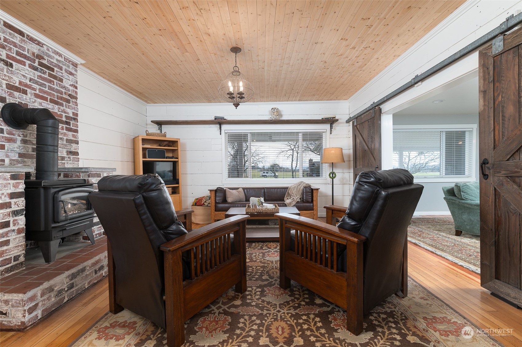 5757 Barr Road Ferndale, WA 98248 - Photo 7 of 40 a view of a dining room with furniture window and wooden floor