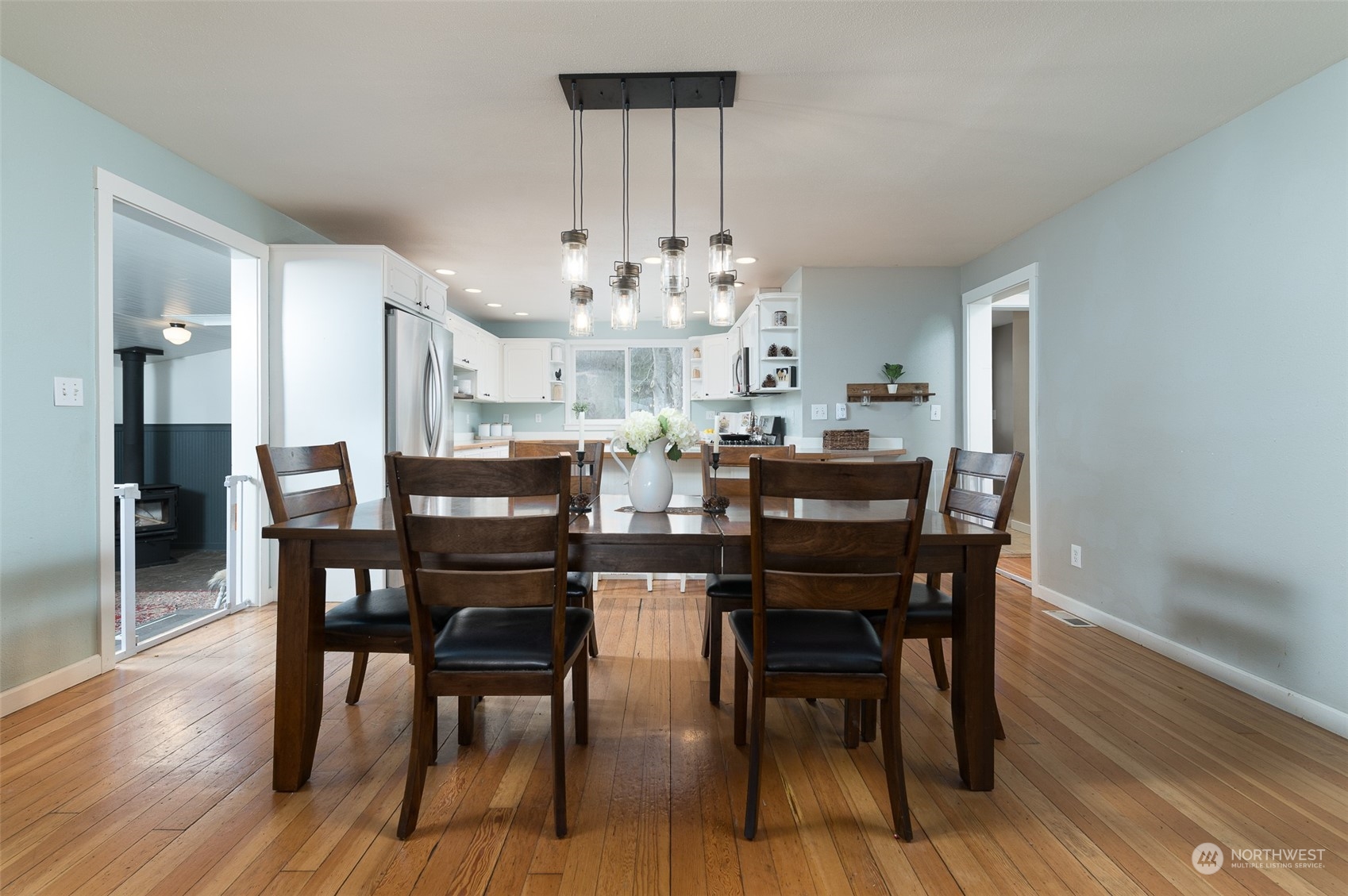5757 Barr Road Ferndale, WA 98248 - Photo 8 of 40 a view of a dining room with furniture and wooden floor