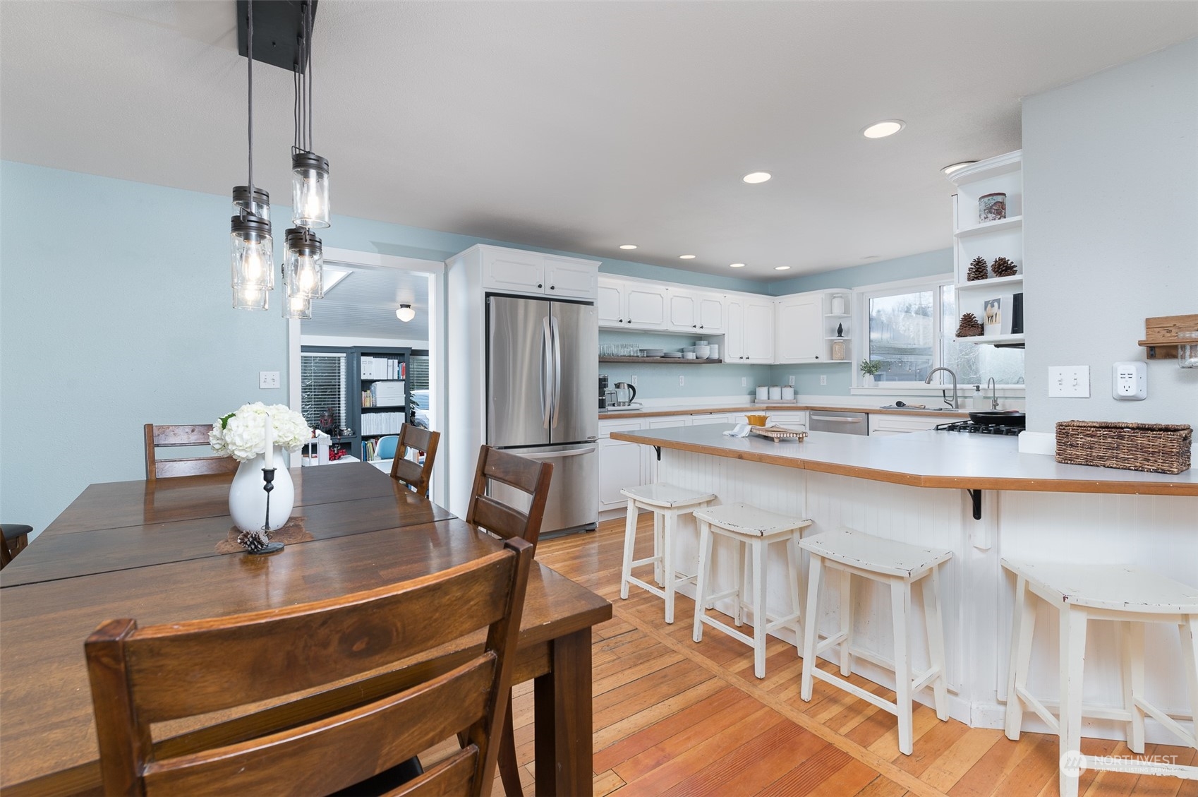5757 Barr Road Ferndale, WA 98248 - Photo 9 of 40 a kitchen with kitchen island a dining table chairs stainless steel appliances and cabinets
