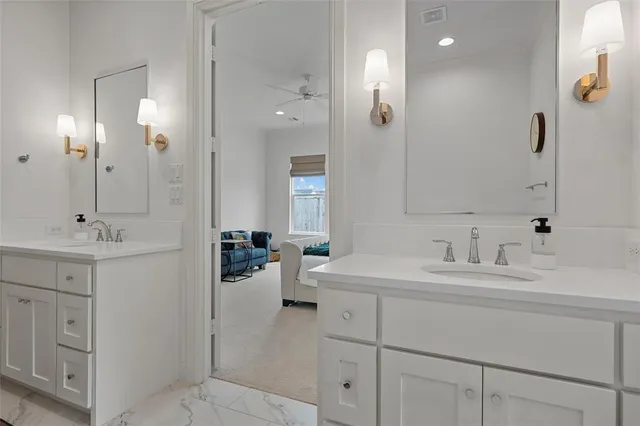 a bathroom with a sink double vanity and a mirror