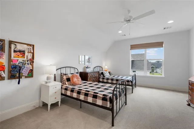 a bedroom with furniture and a window