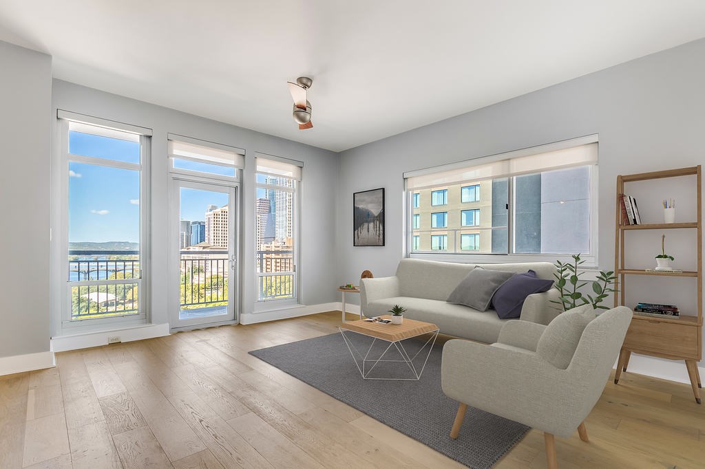 603 Davis Street, Unit 1204 Austin, TX 78701 - Photo 1 of 1 a living room with furniture and a large window