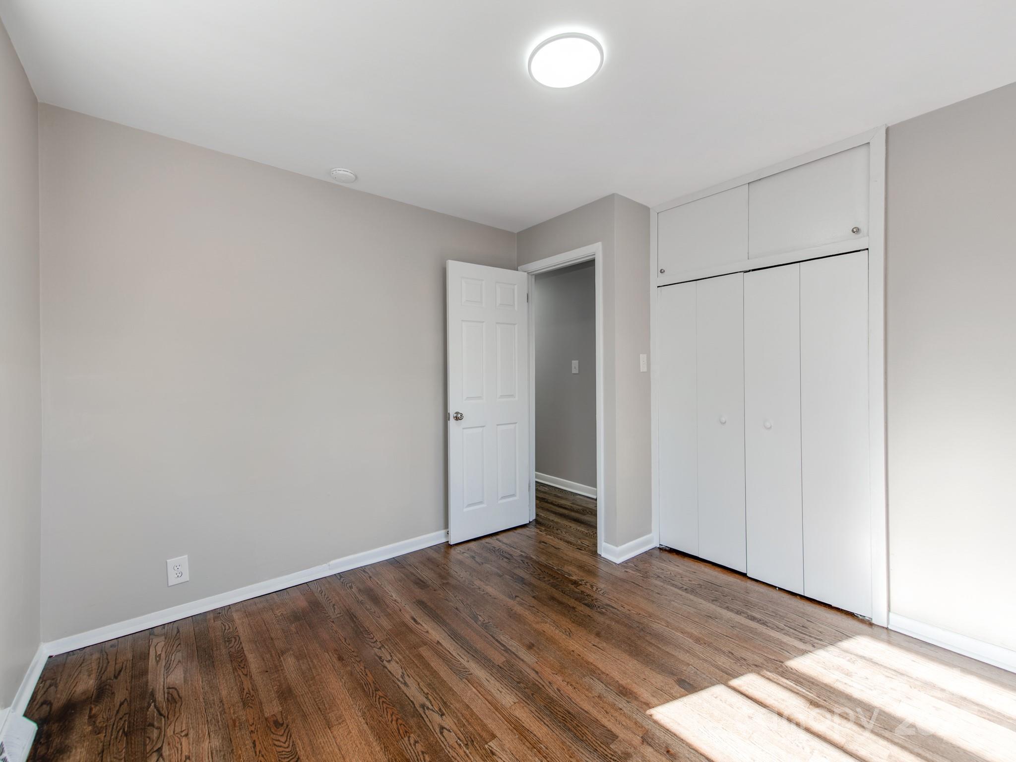 502 McConnell Street Clover, SC 29710 - Photo 15 of 25 a view of an empty room and wooden floor