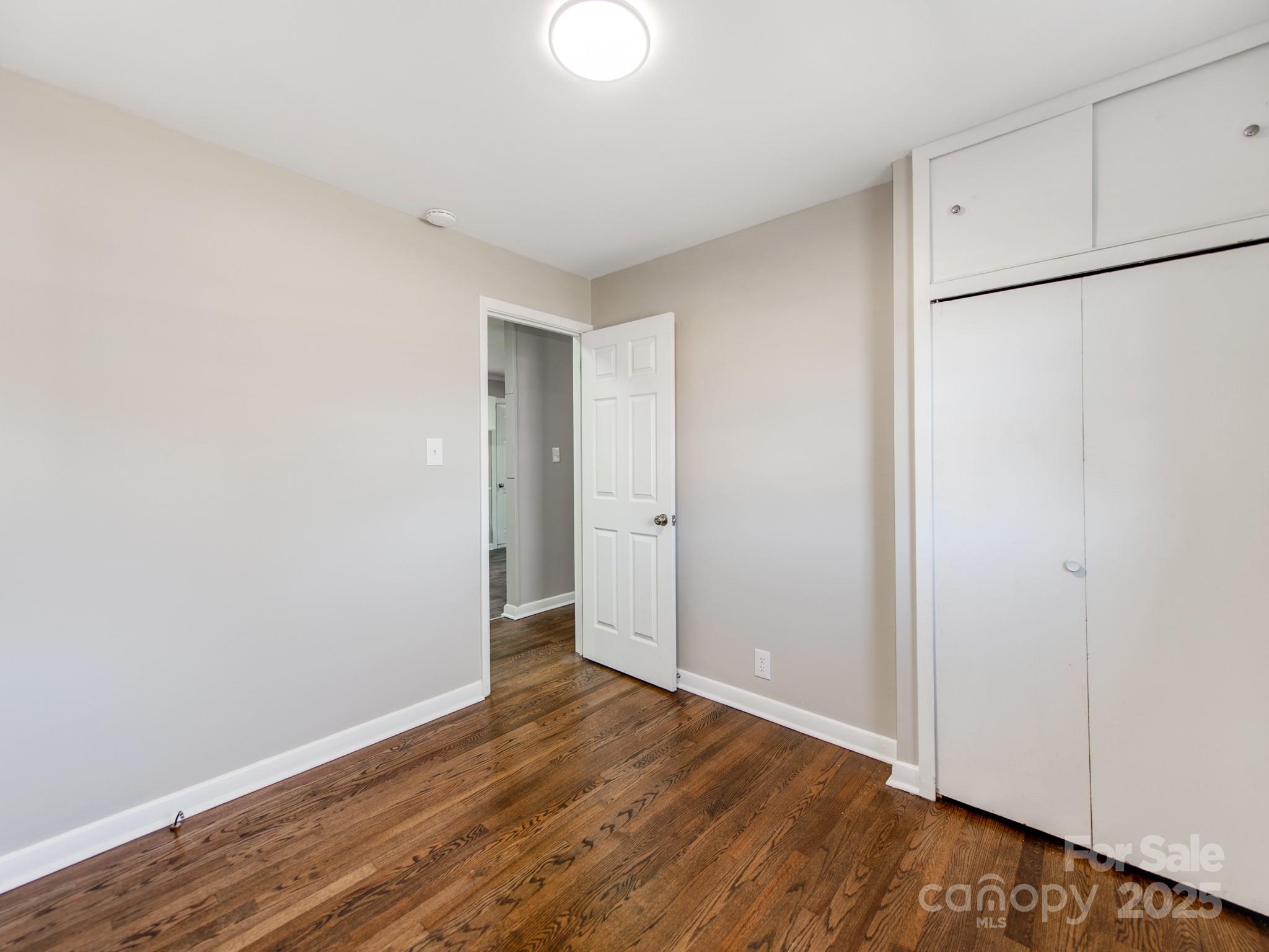 502 McConnell Street Clover, SC 29710 - Photo 19 of 25 a view of an empty room with wooden floor