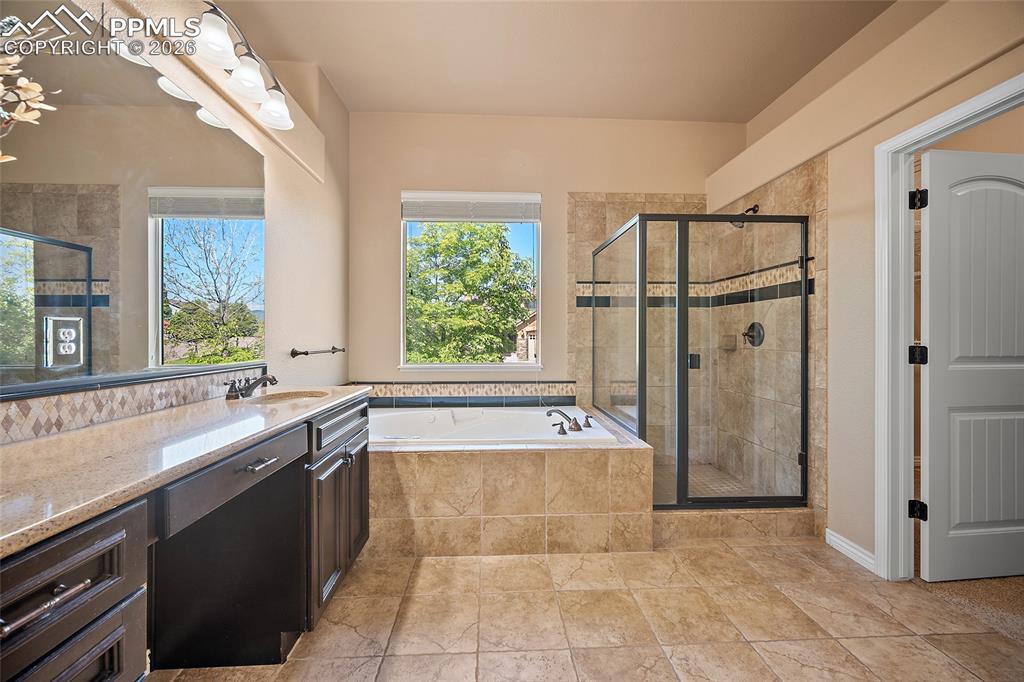1117 Spectrum Loop Colorado Springs, CO 80921 - Photo 15 of 31 a large kitchen with a large tub and sink