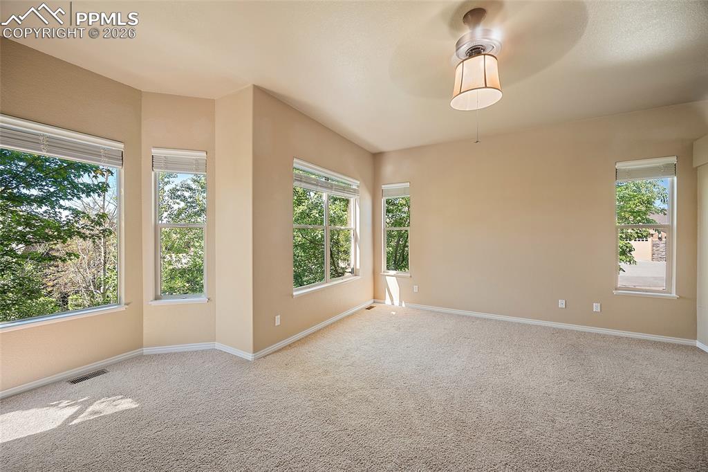 1117 Spectrum Loop Colorado Springs, CO 80921 - Photo 16 of 31 a view of an empty room with a window