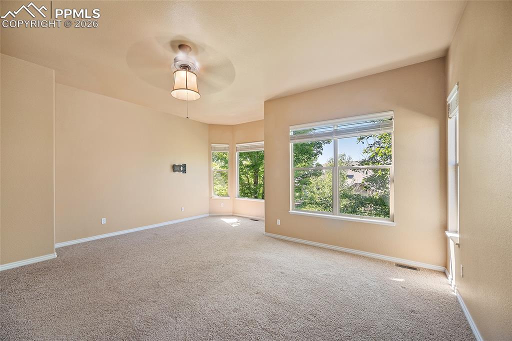1117 Spectrum Loop Colorado Springs, CO 80921 - Photo 17 of 31 a view of an empty room with a window