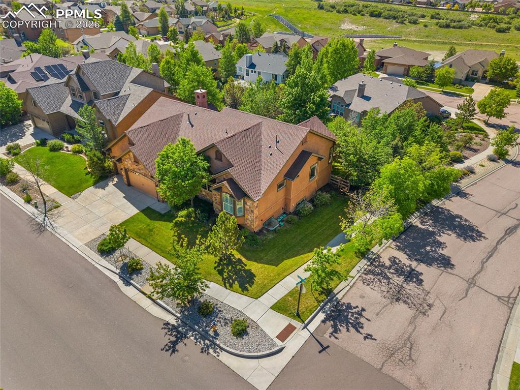 1117 Spectrum Loop Colorado Springs, CO 80921 - Photo 29 of 31 an aerial view of a house with a garden and lake view